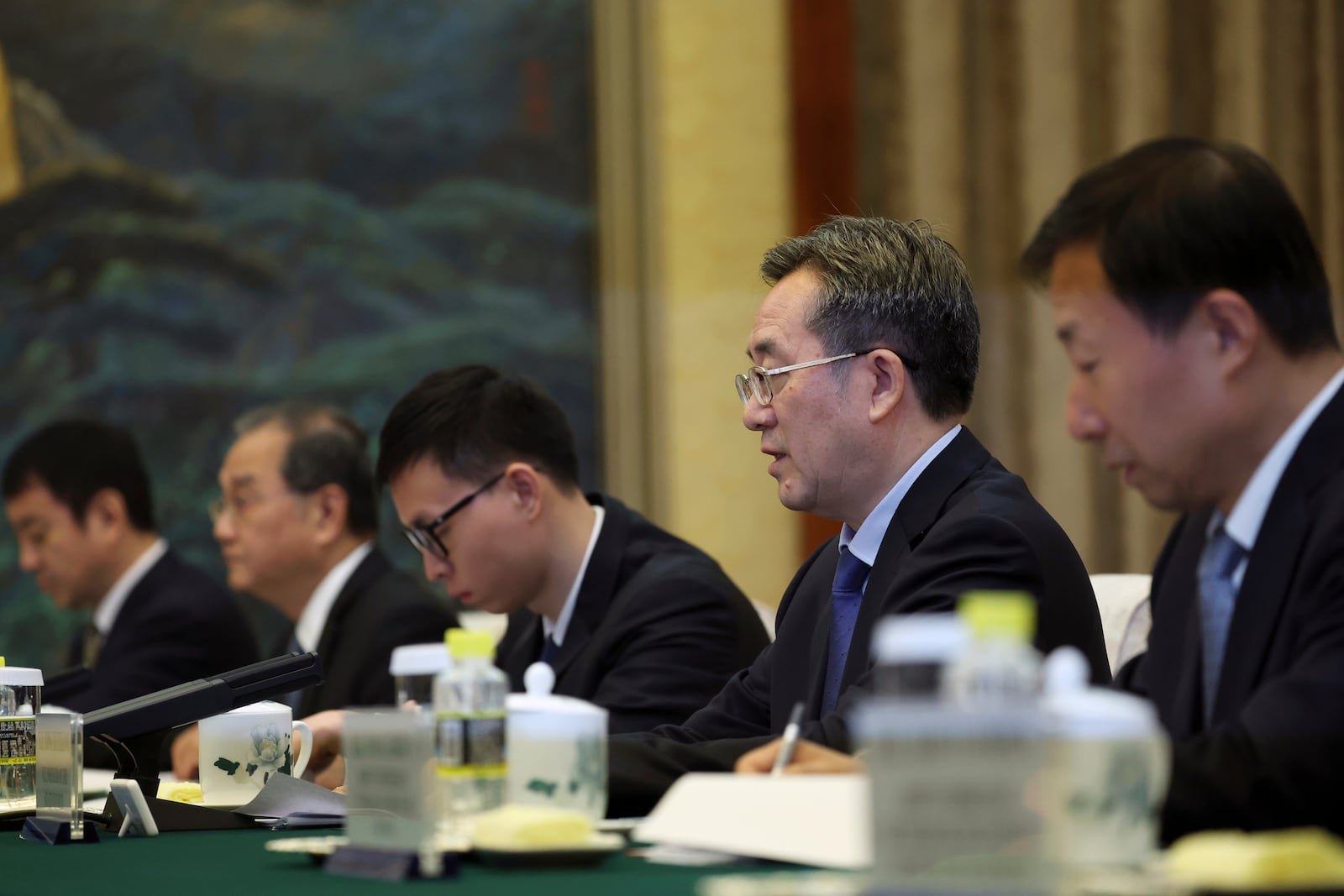 Chinese Vice Premier Ding Xuexiang, second right, attends a meeting with Britain's Foreign Secretary David Lammy, not pictured, at the Great Hall of the People in Beijing Friday, Oct. 18, 2024. (Florence Lo/Pool Photo via AP)