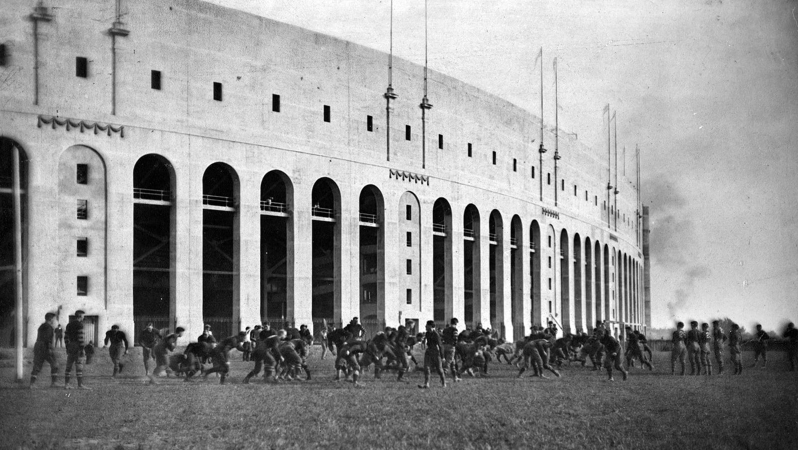 The Ohio State football team plays outside of the recently completed Ohio Stadium in 1923. At the time of the its completion in 1922 the stadium was the largest west of the Allegheny Mountains. PHOTO COURTESY OF THE OHIO HISTORY CONNECTION