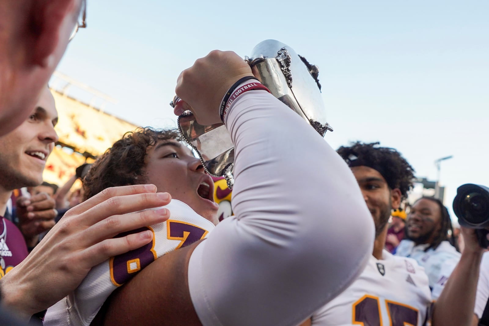 Arizona State wide receiver Zechariah Sample (87) celebrates with the Territorial Cup after beating Arizona in an NCAA college football game, Saturday, Nov. 30, 2024, in Tucson, Ariz. (AP Photo/Samantha Chow)