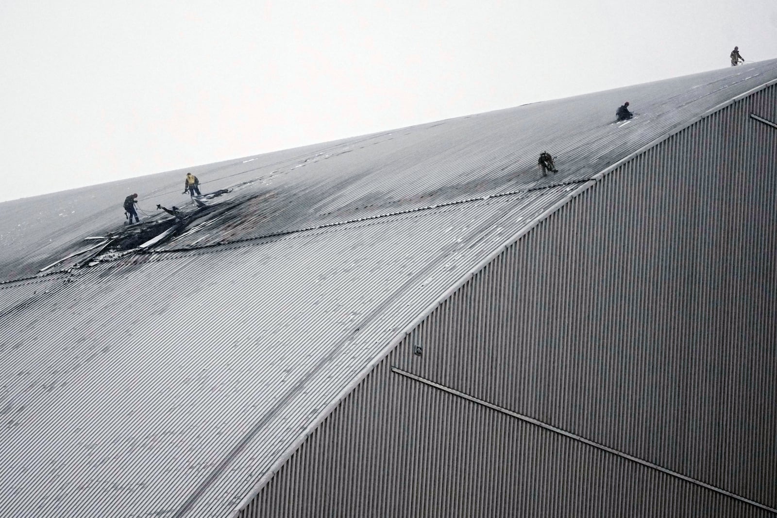 A view of the containment vessel that protects the remains of reactor number four at the former Chernobyl nuclear power plant and built to contain radiation, after a drone attack in Chernobyl, Ukraine, Friday, Feb. 14, 2025. (AP Photo/Efrem Lukatsky)