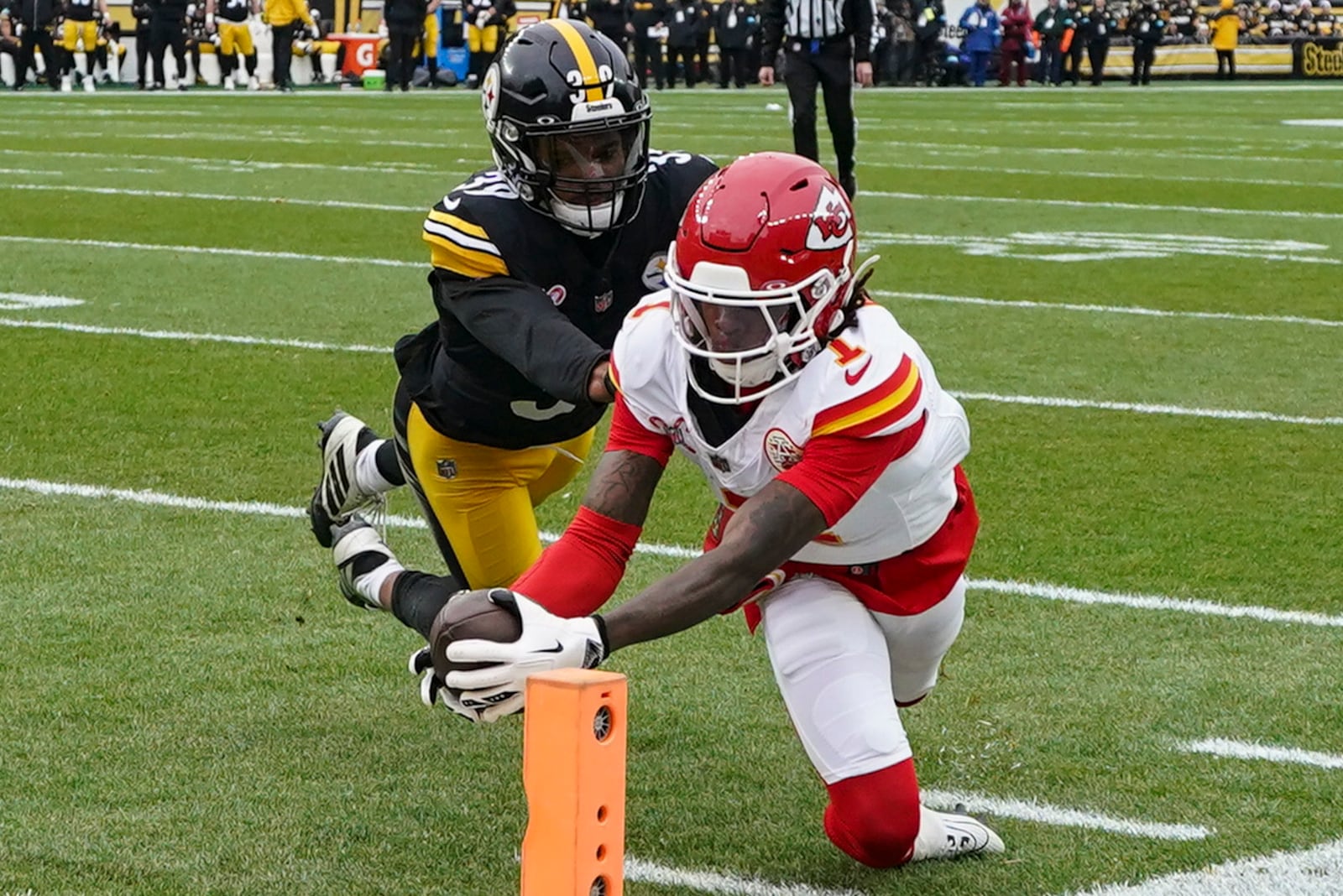 Kansas City Chiefs wide receiver Xavier Worthy (1) scores a touchdown against Pittsburgh Steelers safety Minkah Fitzpatrick (39) during the first half of an NFL football game, Wednesday, Dec. 25, 2024, in Pittsburgh. (AP Photo/Matt Freed)