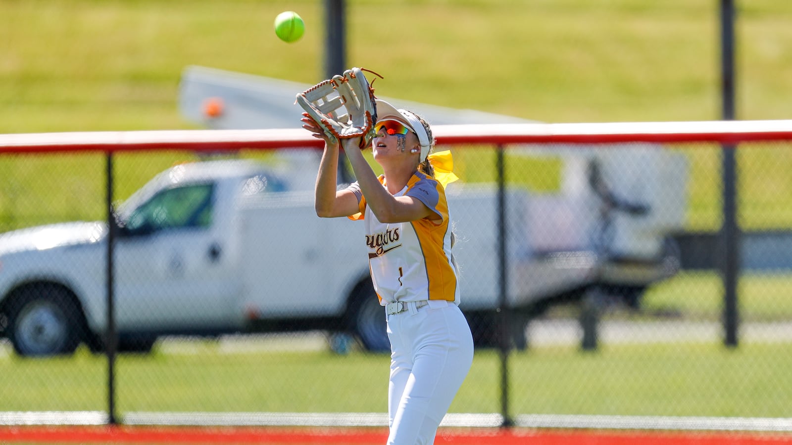 Kenton Ridge High School freshman Chloe Glass catches a flyball during a Division II state semifinal game against Canfield on Friday morning at Firestone Stadium in Akron. The Cardinals won 3-0. Michael Cooper/CONTRIBUTED