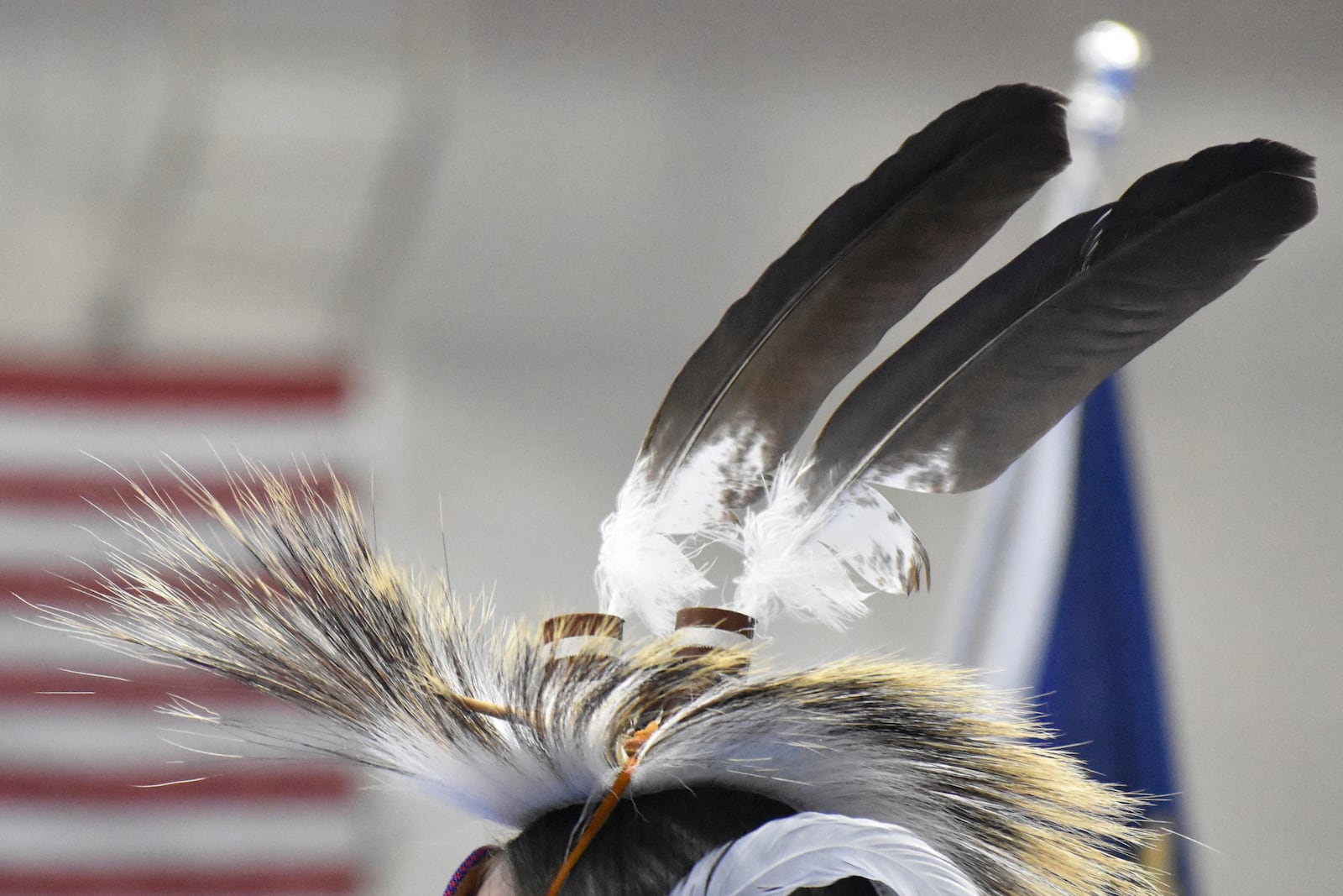 Eagle feathers adorn a headdress during a powwow in Montana, on April 6, 2024. (AP Photo/Matthew Brown)