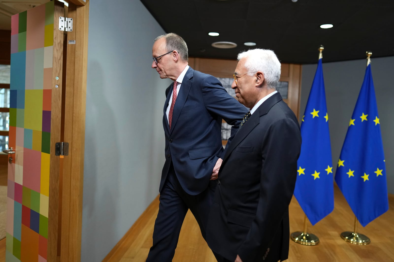 European Council President Antonio Costa, right, greets Friedrich Merz, leader of the Christian Democratic Union, prior to a meeting at the European Council building in Brussels, Thursday, March 6, 2025. (AP Photo/Virginia Mayo)