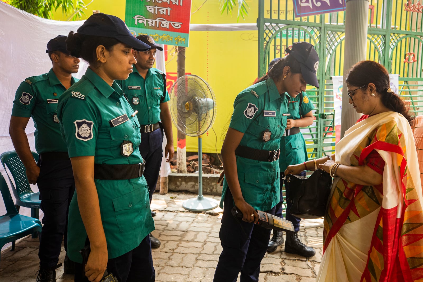 A police woman checks a bag of a woman devotee at the Dhakeshwari National Temple during the Durgapuja festival in Dhaka, Bangladesh, on Oct. 10, 2024. (AP Photo/Rajib Dhar)