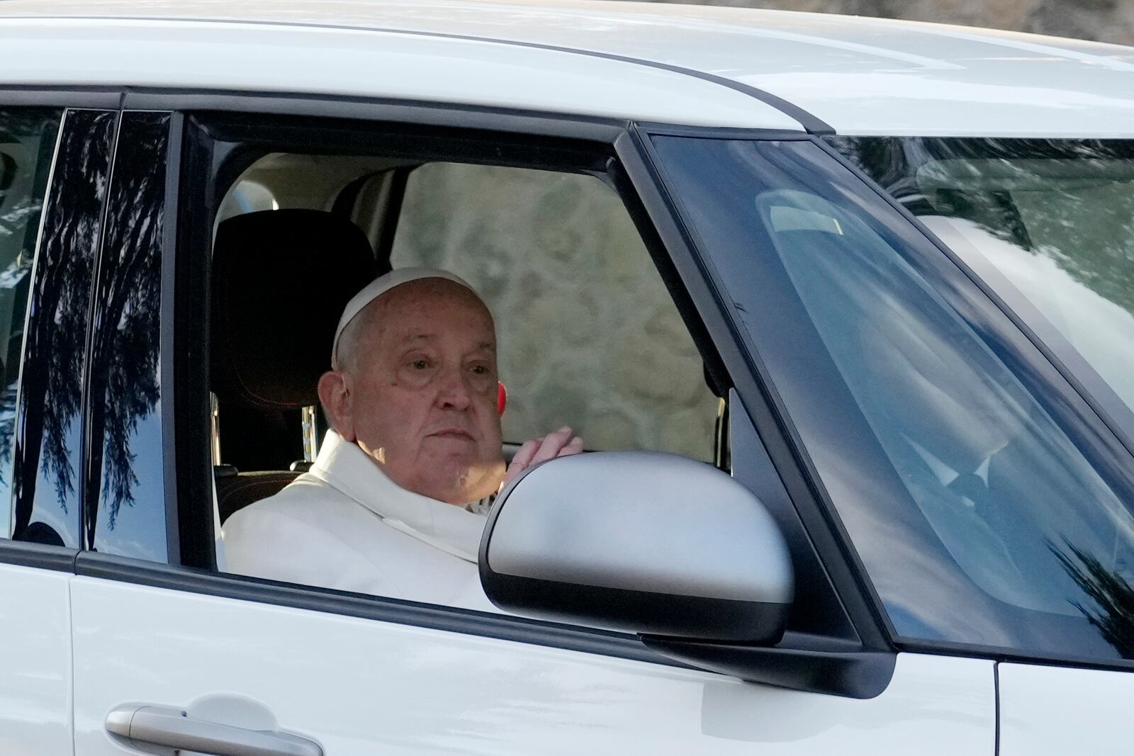 Pope Francis arrives at Rebibbia prison for the event of the opening of the Holy Door of the chapel at the prison in Rome, Thursday, Dec. 26, 2024. (AP Photo/Gregorio Borgia)