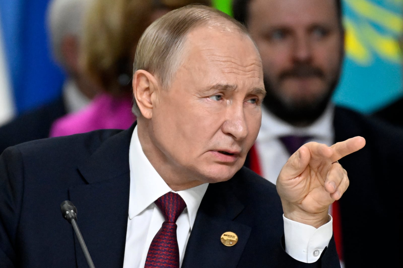 Russian President Vladimir Putin gestures during BRICS Summit extended format session in Kazan, Russia, Wednesday, Oct. 23, 2024. (Alexander Nemenov, Pool Photo via AP)