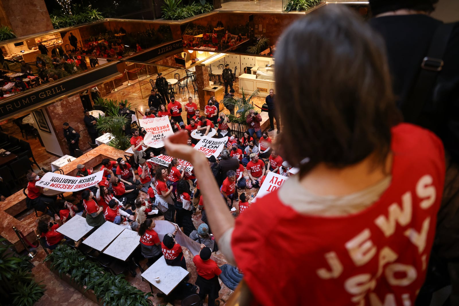 Demonstrators from the group, Jewish Voice for Peace, protest inside Trump Tower in support of Columbia graduate student Mahmoud Khalil, Thursday, March 13, 2025, in New York. (AP Photo/Yuki Iwamura)