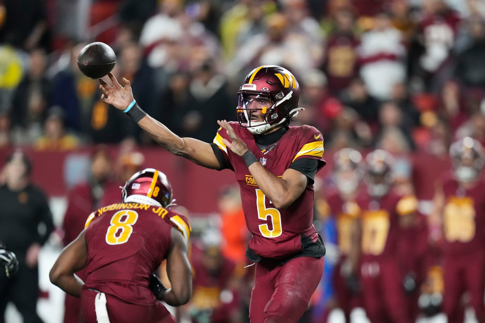 Washington Commanders quarterback Jayden Daniels (5) passes during the second half of an NFL football game, against the Atlanta Falcons Sunday, Dec. 29, 2024, in Landover, Md. (AP Photo/Stephanie Scarbrough)