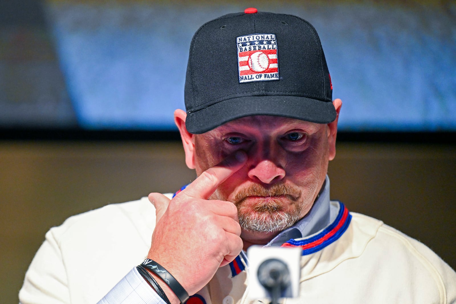 Newly-elected Baseball Hall of Fame inductee Billy Wagner wipes his eye while talking to reporters during a news conference Thursday, Jan. 23, 2025, in Cooperstown, N.Y. (AP Photo/Hans Pennink)