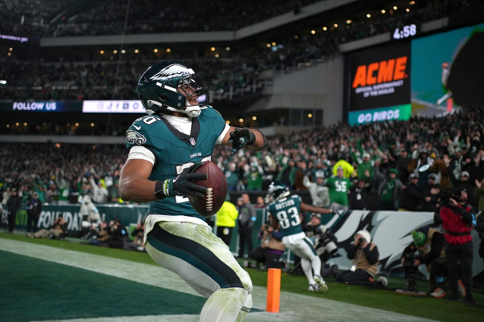 Philadelphia Eagles running back Saquon Barkley (26) celebrates after scoring during the second half of an NFL football game against the Washington Commanders Thursday, Nov. 14, 2024, in Philadelphia. (AP Photo/Matt Slocum)