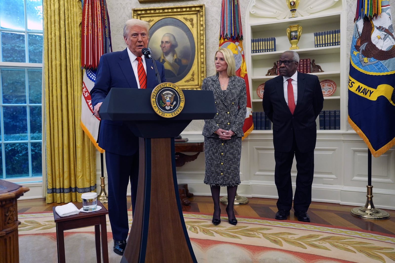 President Donald Trump welcomes Pam Bondi before she is sworn in as Attorney General by Supreme Court Associate Justice Clarence Thomas, right, in the Oval Office of the White House, Wednesday, Feb. 5, 2025, in Washington. (AP Photo/Evan Vucci)