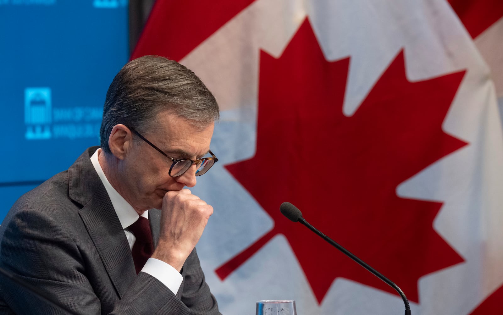 Bank of Canada Governor Tiff Macklem waits for a news conference to begin, Wednesday, Dec. 11, 2024 in Ottawa, Ontario. (Adrian Wyld/The Canadian Press via AP)