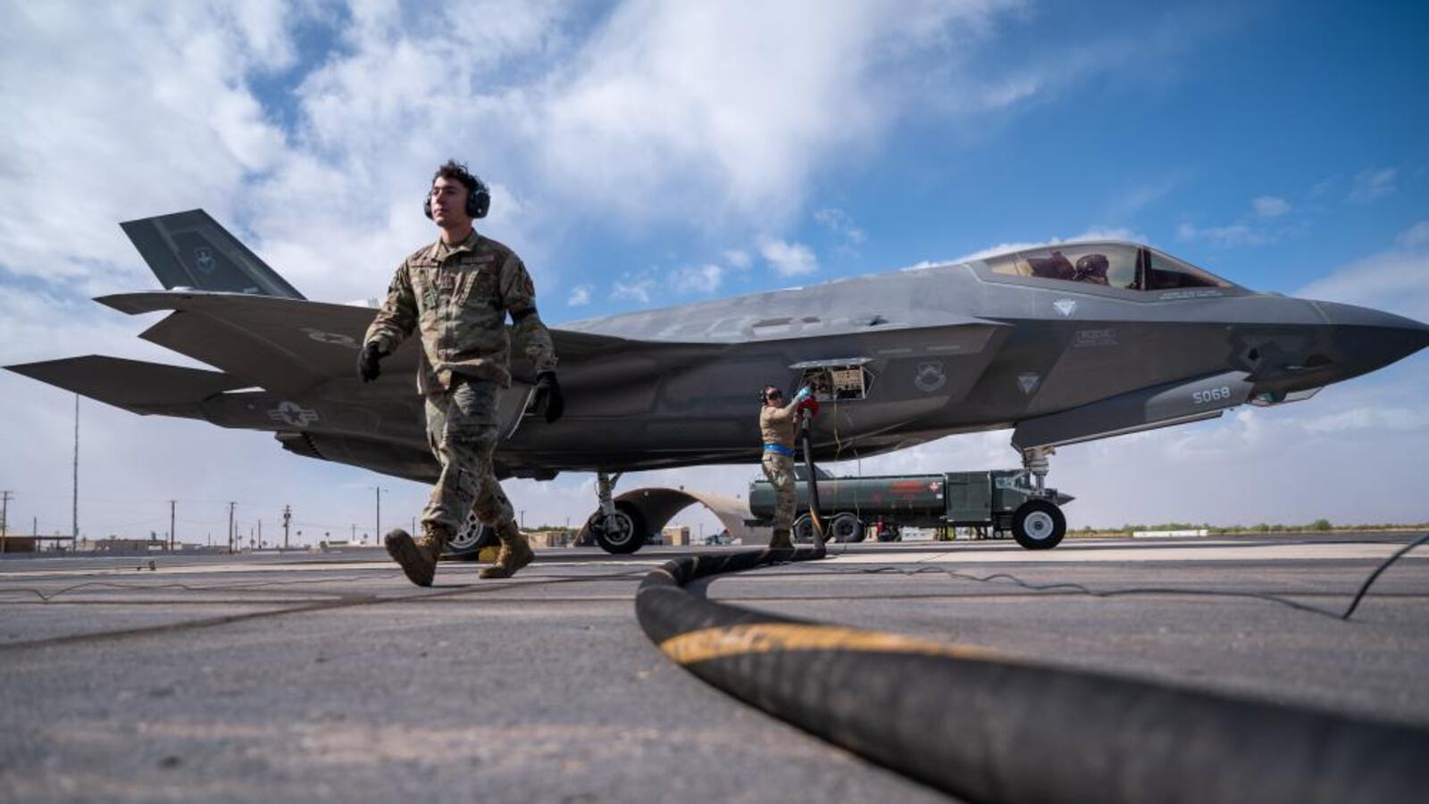 U.S. Air Force 62nd Aircraft Maintenance Unit crew chiefs refuel an F-35 Lightning II, Nov. 3, 2022, at Gila Bend Air Force Auxiliary Field, Arizona.  (U.S. Air Force photo by Airman Mason Hargrove)