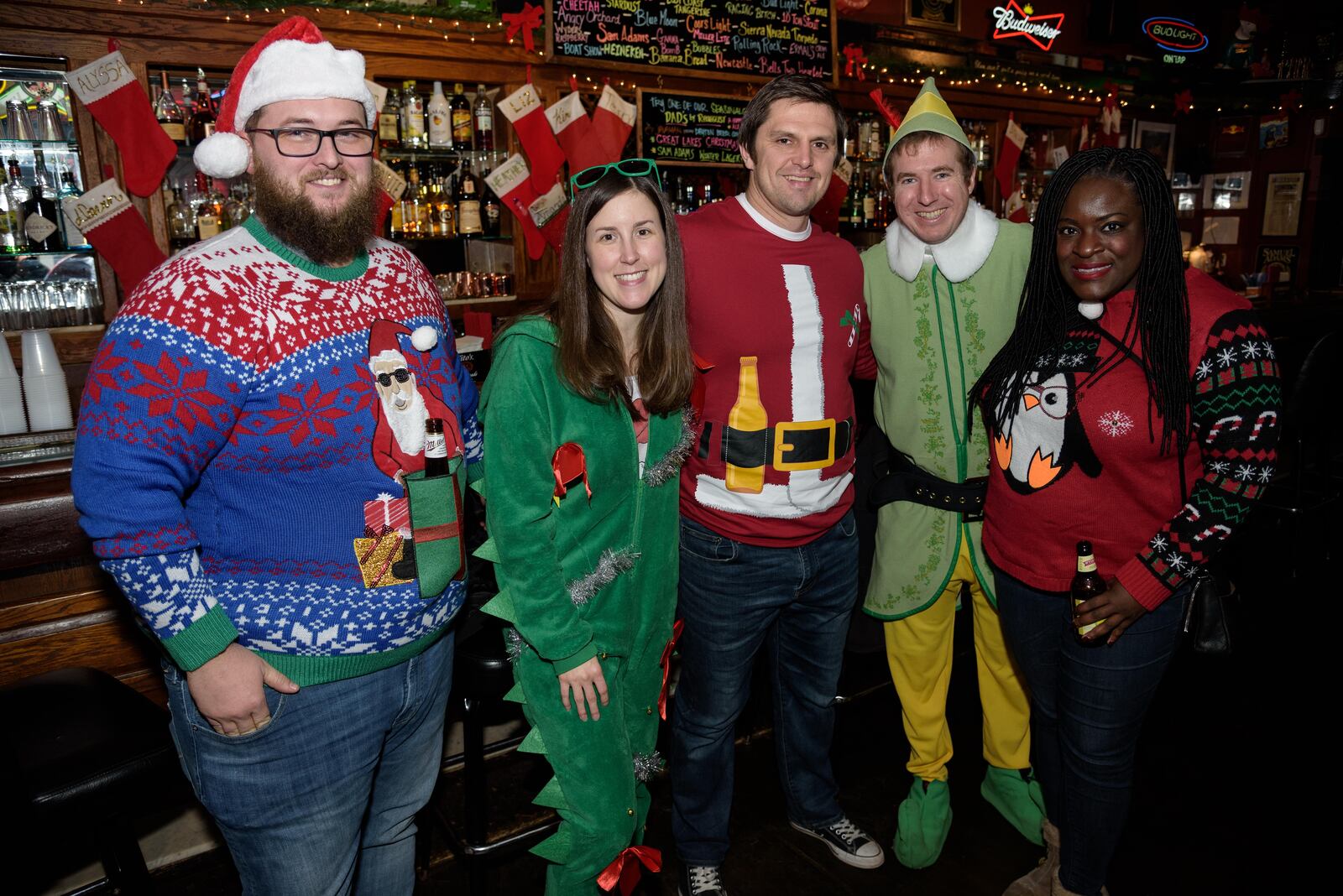 A horde of jolly old elves, a bunch of reindeer and ton of other fun-lovers dressed in Christmas-themed costumes celebrated the season in the Oregon District during the 13th Annual Santa Pub Crawl on Saturday, Dec. 8. The mission was to gather gifts for the Marines' Dayton area Toys for Tots program. TOM GILLIAM / CONTRIBUTING PHOTOGRAPHER