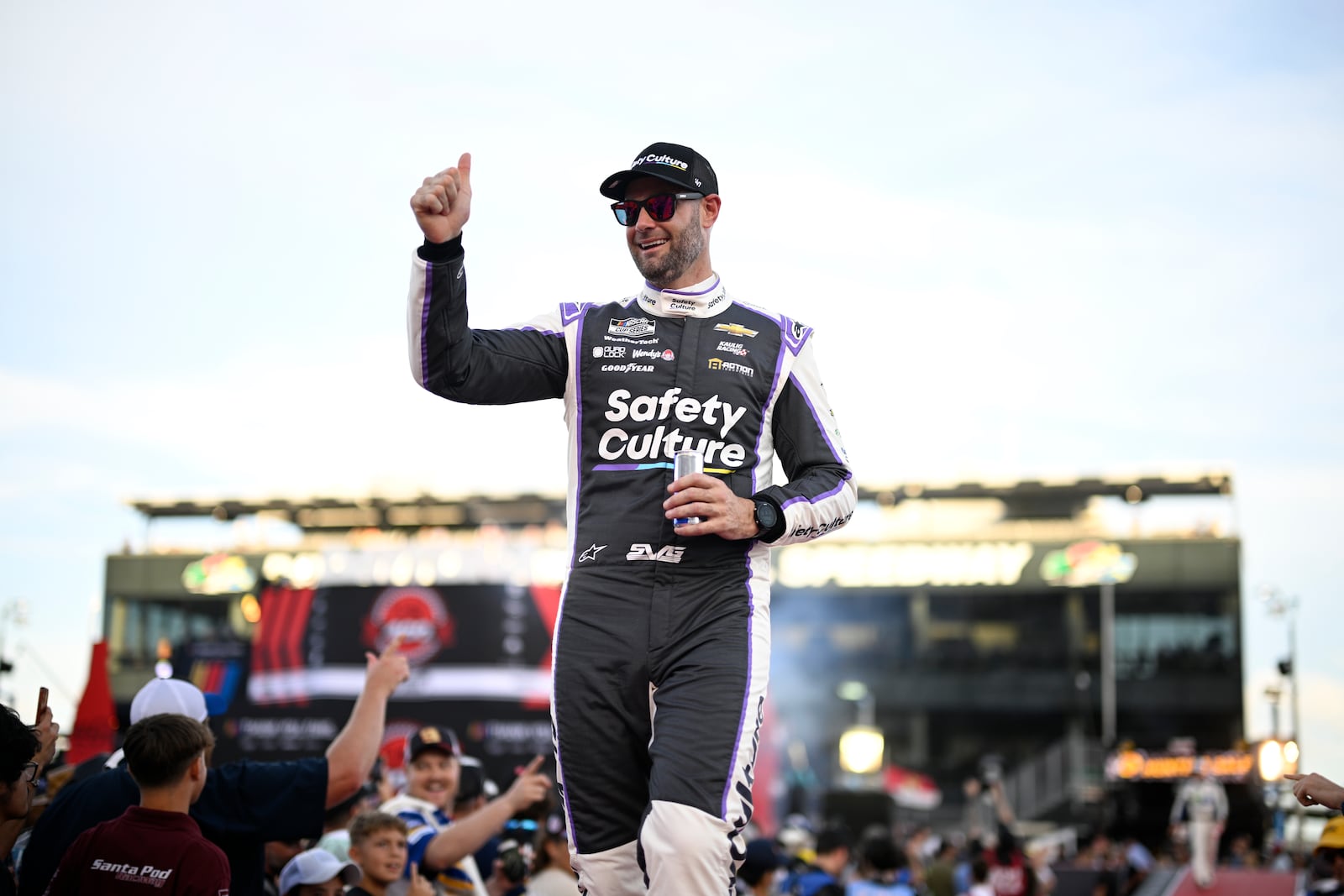 FILE - Shane van Gisbergen interacts with spectators during driver introductions before a NASCAR Cup Series auto race at Daytona International Speedway, Aug. 24, 2024, in Daytona Beach, Fla. (AP Photo/Phelan M. Ebenhack, File)