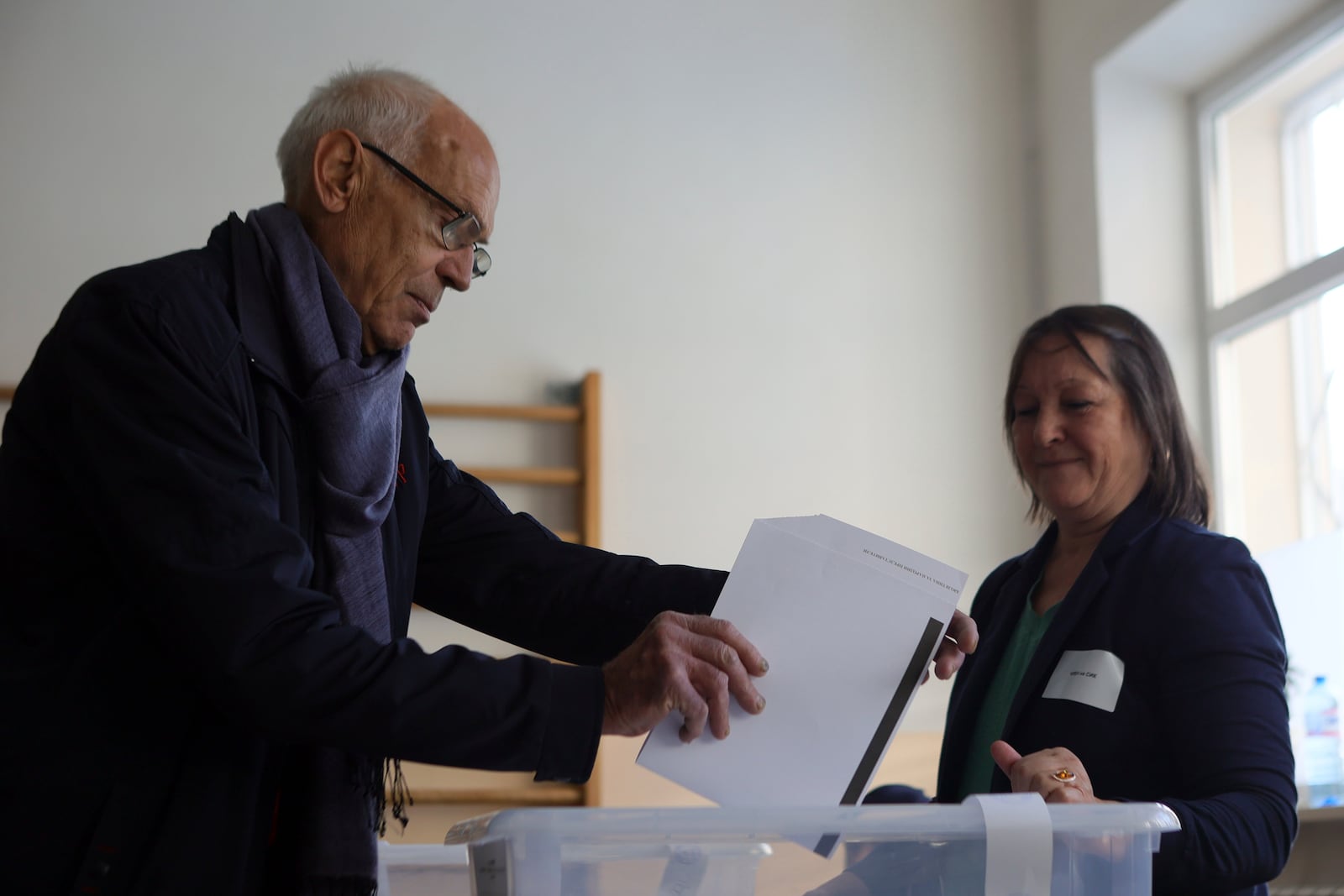 A man casts his ballot at a polling station during the general elections in Sofia, Sunday, Oct. 27, 2024. (AP Photo/Valentina Petrova)