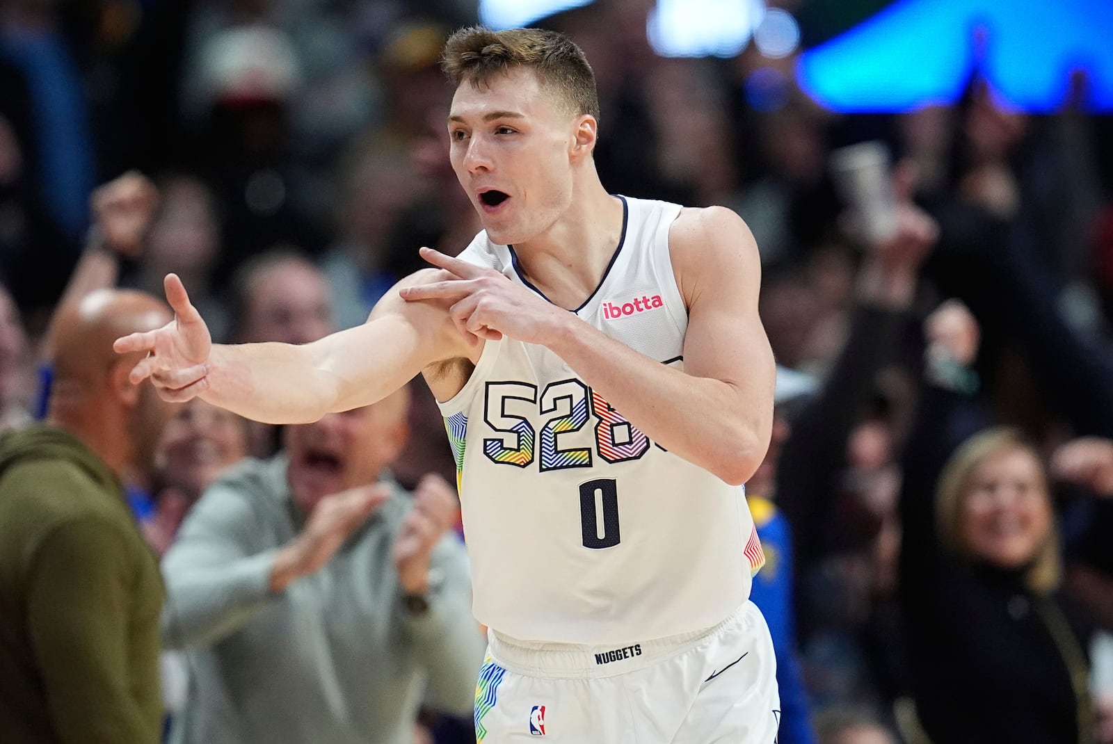 Denver Nuggets guard Christian Braun reacts after hitting a 3-point basket in overtime of an NBA basketball game against the Phoenix Suns, Friday, March 7, 2025, in Denver. (AP Photo/David Zalubowski)