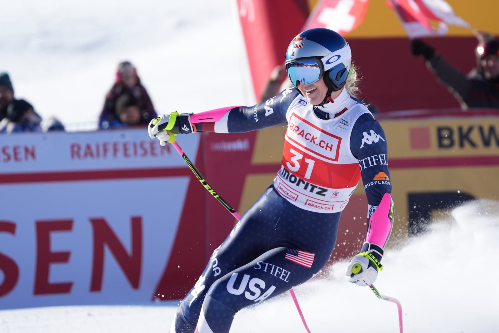 United States' Lindsey Vonn celebrates at the finish area of an alpine ski, women's World Cup super G, in St. Moritz, Switzerland, Saturday, Dec. 21, 2024. (AP Photo/Giovanni Auletta)