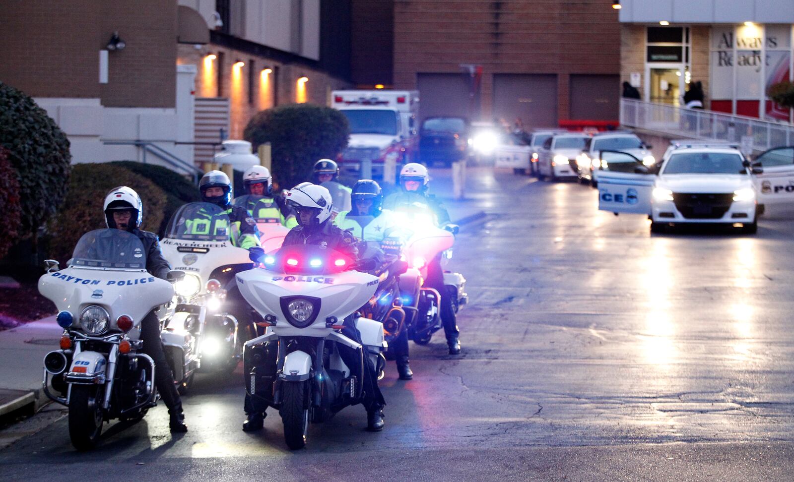 The body of Det. Jorge Del Rio was escorted from Grandview Hospital by a procession of police vehicles to the Montgomery County Coroner's Office Thursday evening. Del Rio was shot twice and critically injured Monday evening while serving a drug-related warrant as part of a DEA task force. LISA POWELL / STAFF