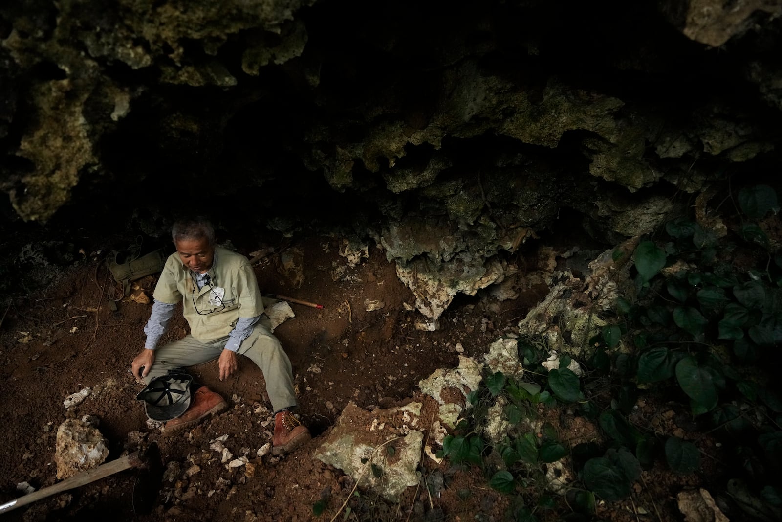 Takamatsu Gushiken, a "gamafuya," an Okinawa dialect meaning a person who digs in a cave, speaks during an interview with The Associated Press after searching for the remains of those who died during the Battle of Okinawa towards the end of the World War II in 1945, in Itoman, on the main island of the Okinawa archipelago, southern Japan, Saturday, Feb. 15, 2025. (AP Photo/Hiro Komae)