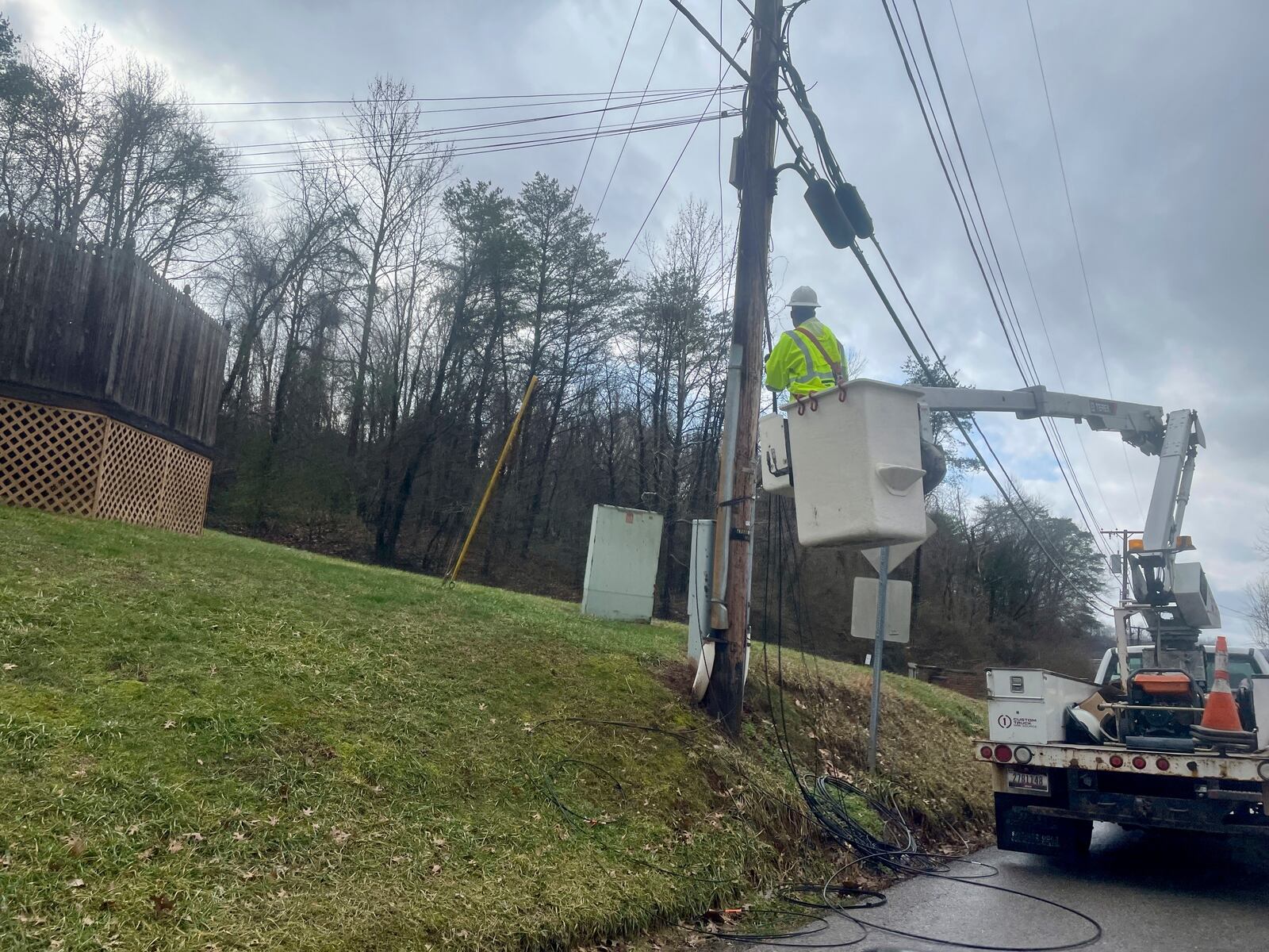 A utility crew works on a pole after heavy thunderstorms rolled through Thursday, Feb. 6, 2025, in Poca, W.Va. (AP Photo/John Raby)