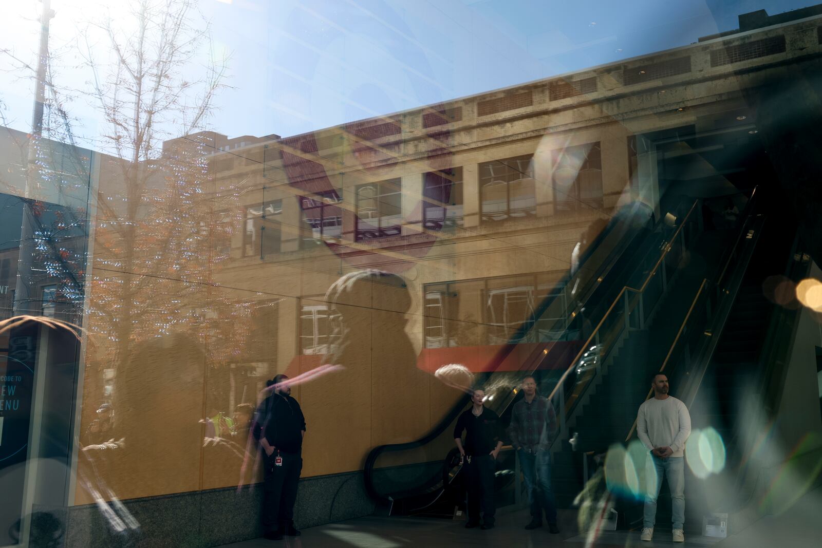 Security stands by inside Target Corporation's headquarters while a news conference organized by Black Lives Matter Minnesota is underway Thursday, Jan. 30, 2025, in Minneapolis, Minn. (AP Photo/Ellen Schmidt)