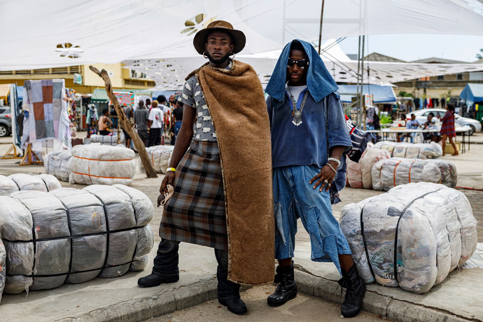 Attendees pose for a photograph during a thrift and an upcycle show in Accra, Ghana, Sunday, Oct. 27, 2024. (AP Photo/Misper Apawu)