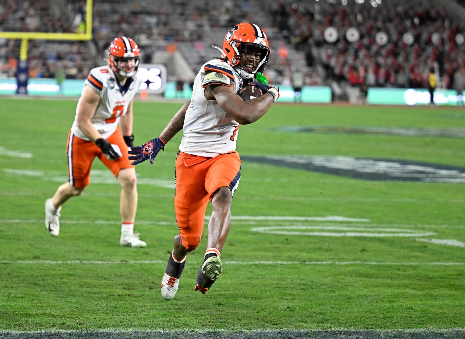 Syracuse running back LeQuint Allen (1) scores on a two-point conversion during the first half of the Holiday Bowl NCAA college football game against Washington State Friday, Dec. 27, 2024, in San Diego. (AP Photo/Denis Poroy)