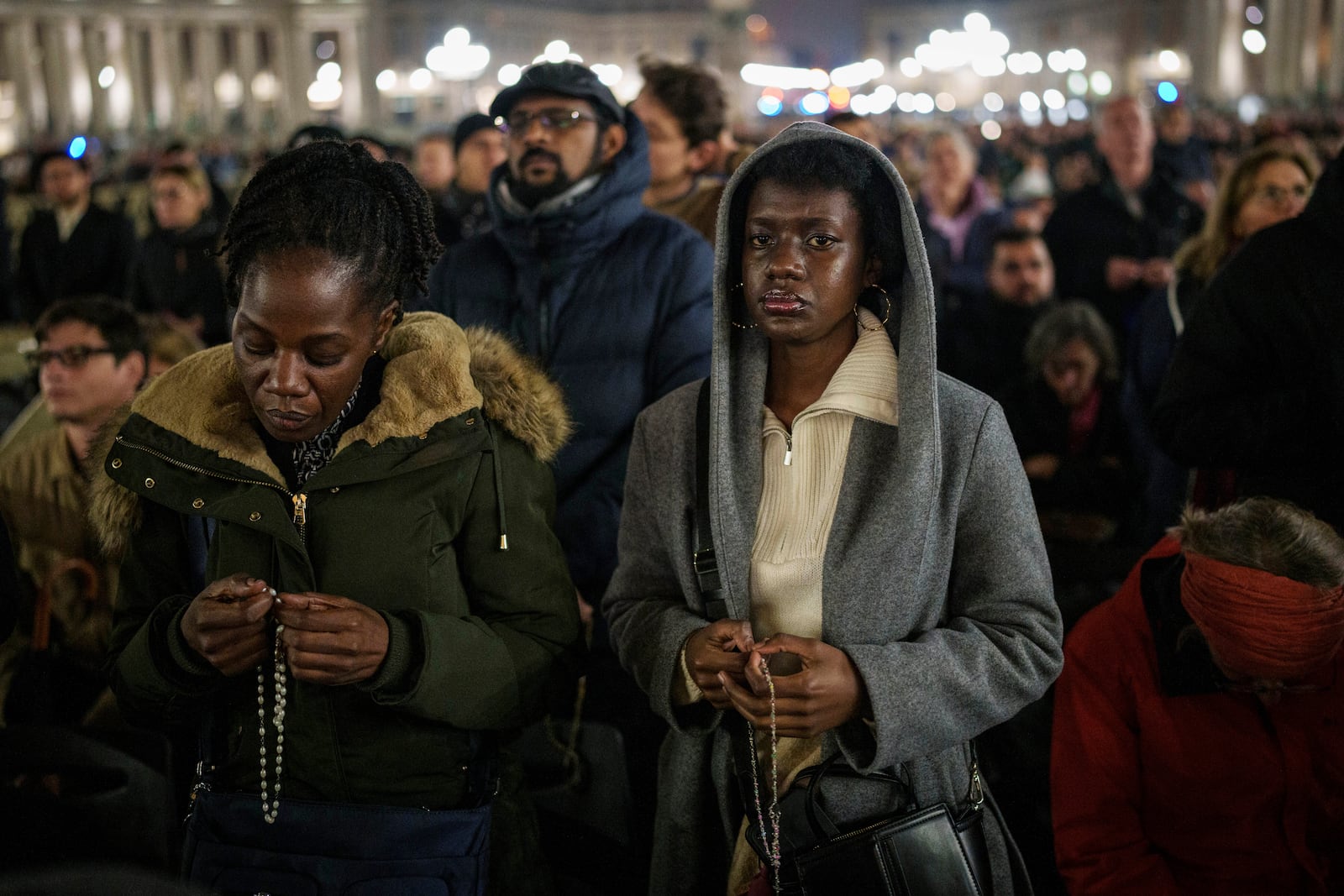 Faithful gather to pray the rosary for the health of Pope Francis in St. Peter's Square at The Vatican, Monday, Feb. 24, 2025. (AP Photo/Bernat Armangue)