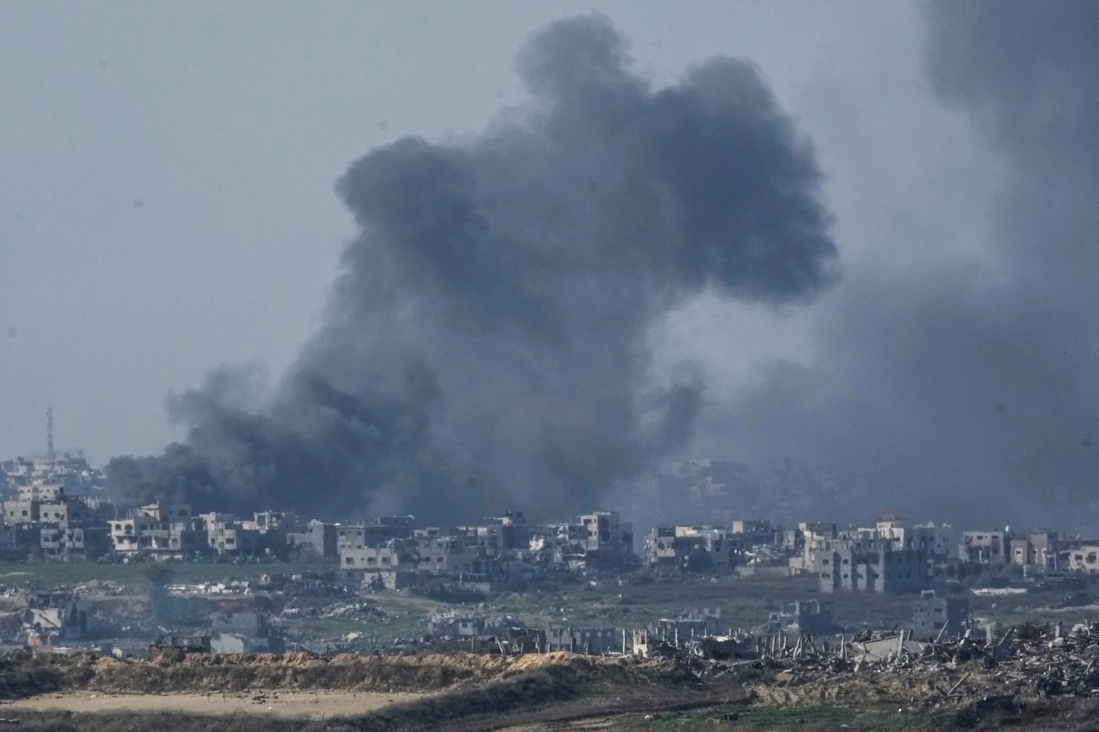 Smoke rises following an explosion in the Gaza Strip, as seen from southern Israel, Thursday, Jan. 9, 2025. (AP Photo/Mahmoud Illean)