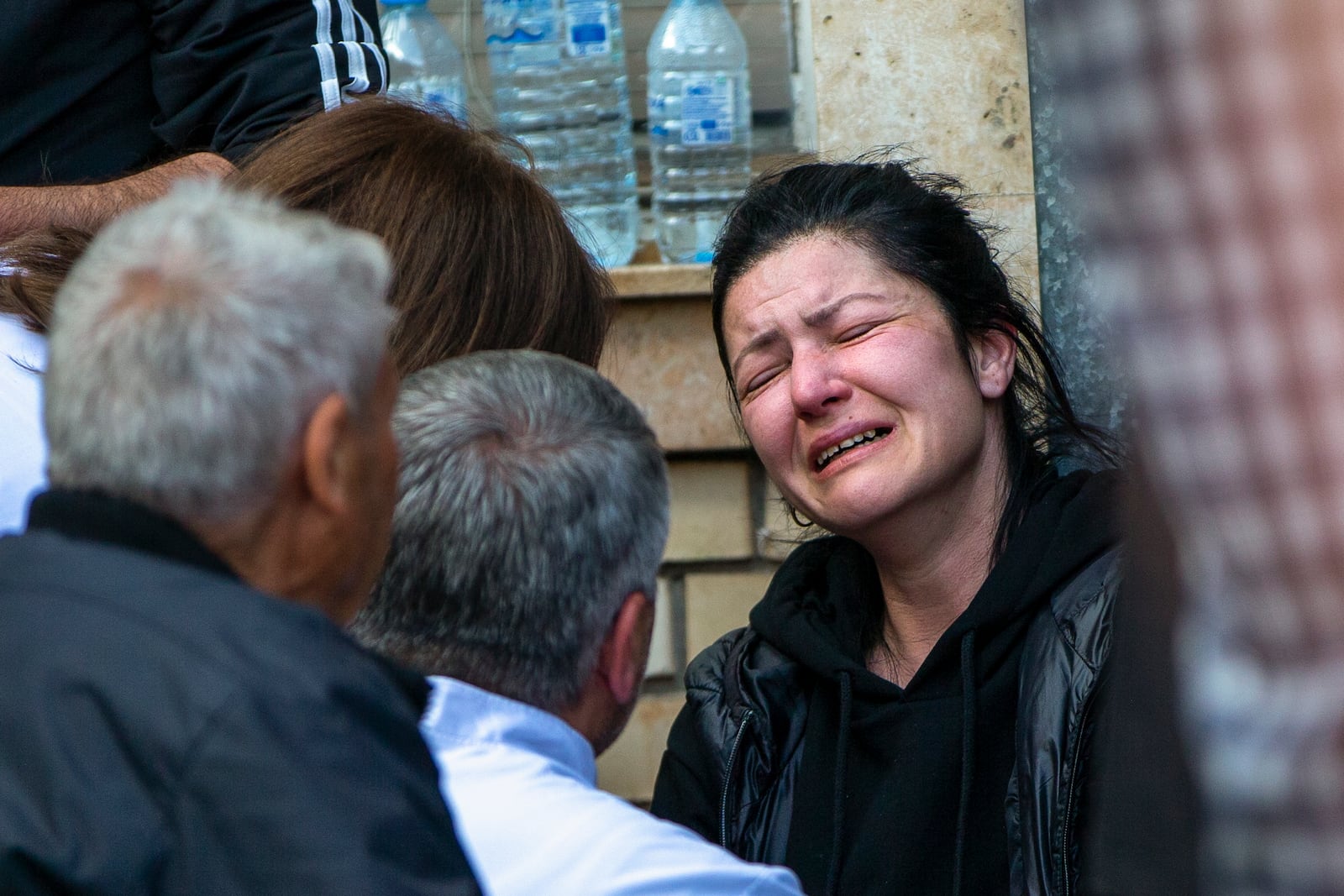 A woman cries outside a hospital in the town of Kocani, North Macedonia, Sunday, March 16, 2025, following a massive fire in a nightclub early Sunday. (AP Photo/Visar Kryeziu)