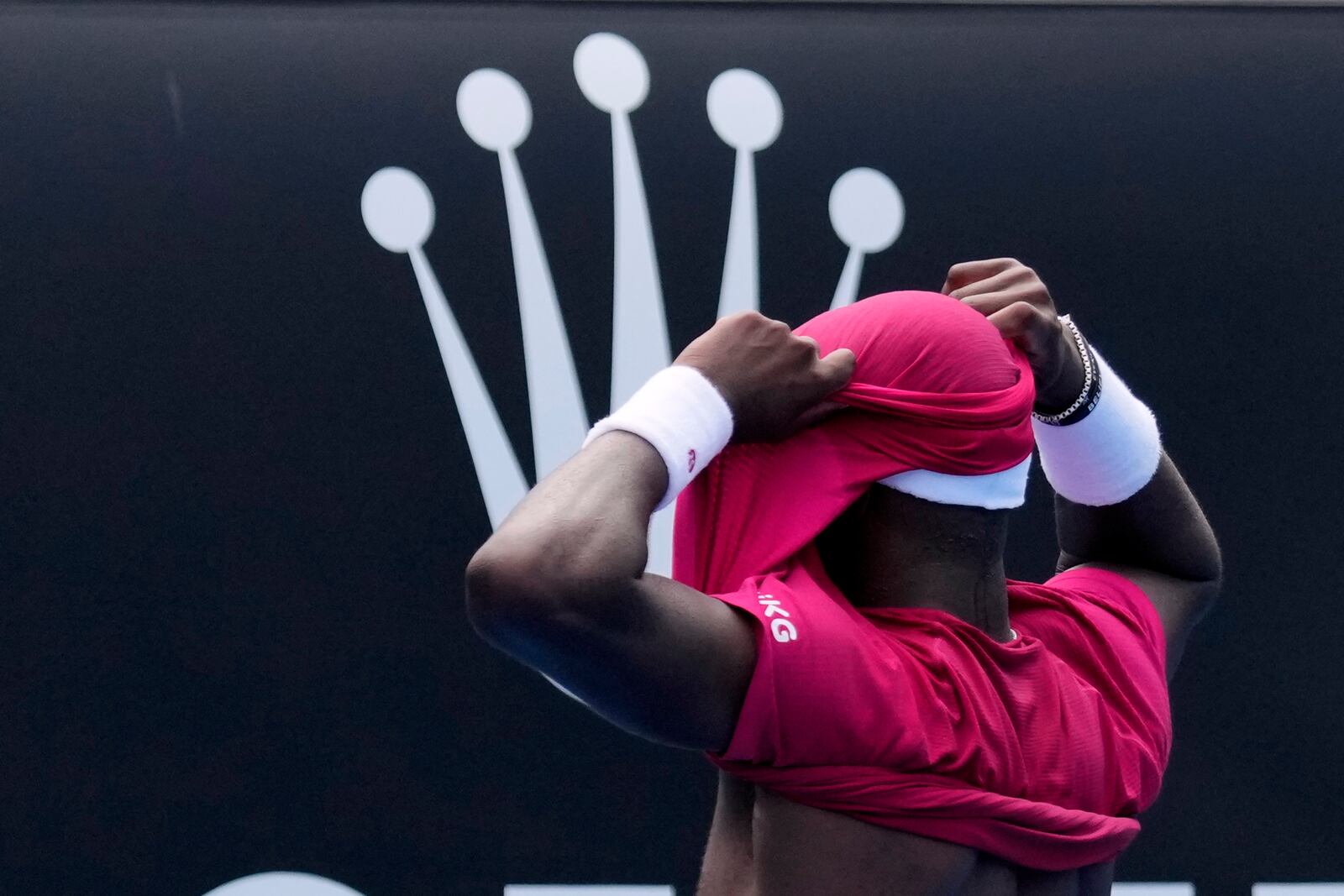 Frances Tiafoe of the U.S. celebrates after defeating Arthur Rinderknech of France in their first round match at the Australian Open tennis championship in Melbourne, Australia, Monday, Jan. 13, 2025. (AP Photo/Vincent Thian)