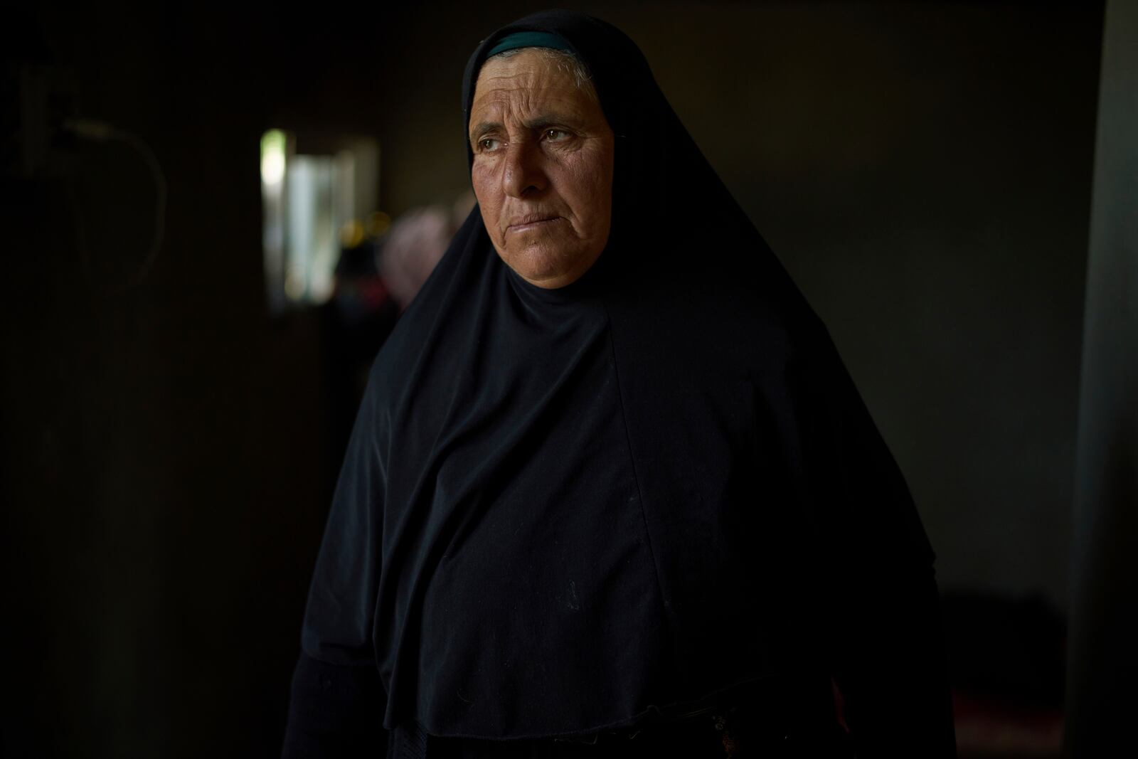 Hamdi Ballal, mother of Hamdan Ballal, a Palestinian co-director of the Oscar winner documentary "No Other Land", who was attacked by Jewish settlers before being detained by the Israeli army, looks on in their house in the village of Susiya in Masafer Yatta, south Hebron hills Tuesday, March 25, 2025. (AP Photo/Leo Correa)