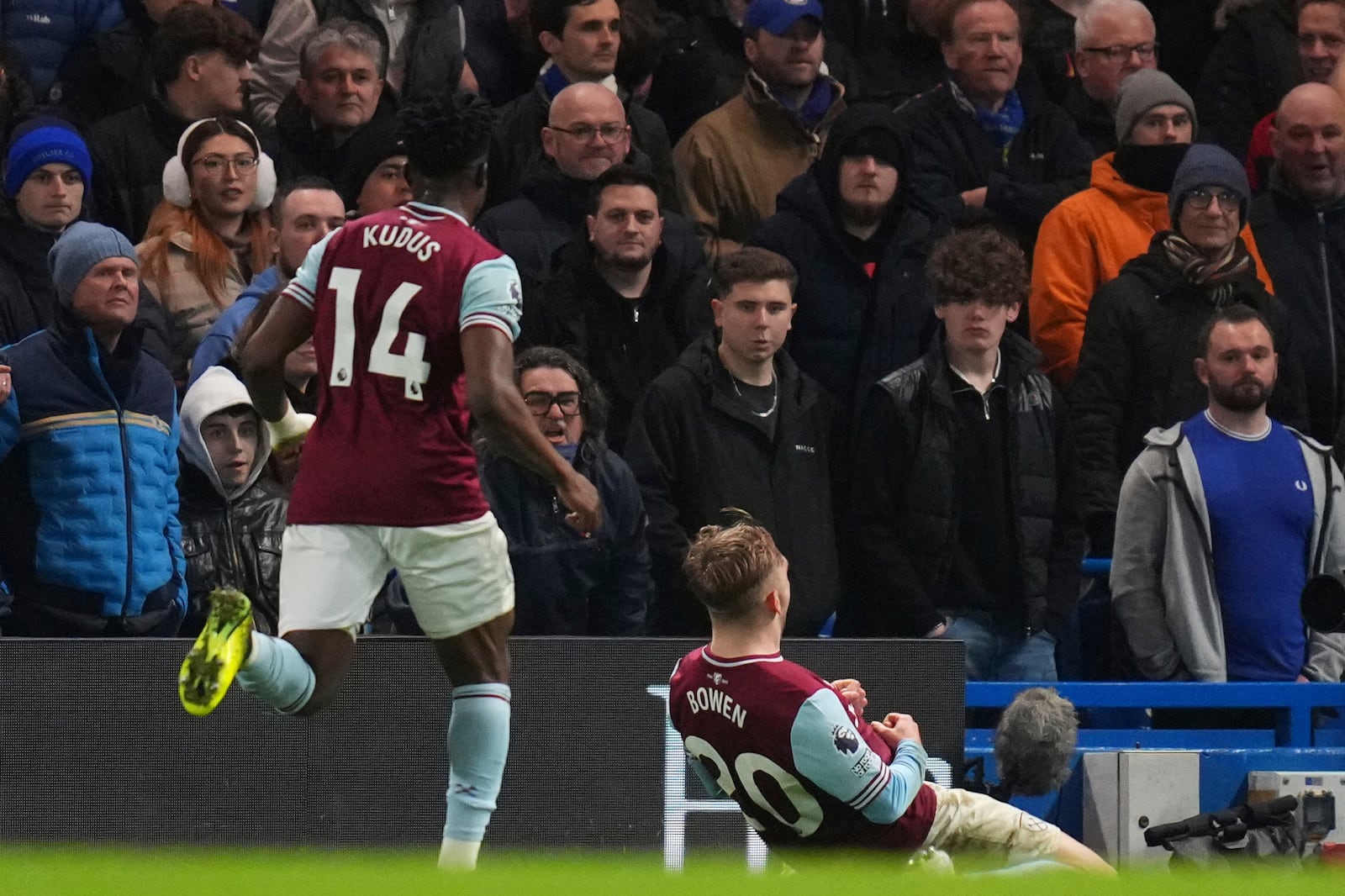 West Ham's Jarrod Bowen, bottom, celebrates after scoring his side's opening goal during the English Premier League soccer match between Chelsea and West Ham United at Stamford Bridge stadium in London, Monday, Feb. 3, 2025. (AP Photo/Kirsty Wigglesworth)