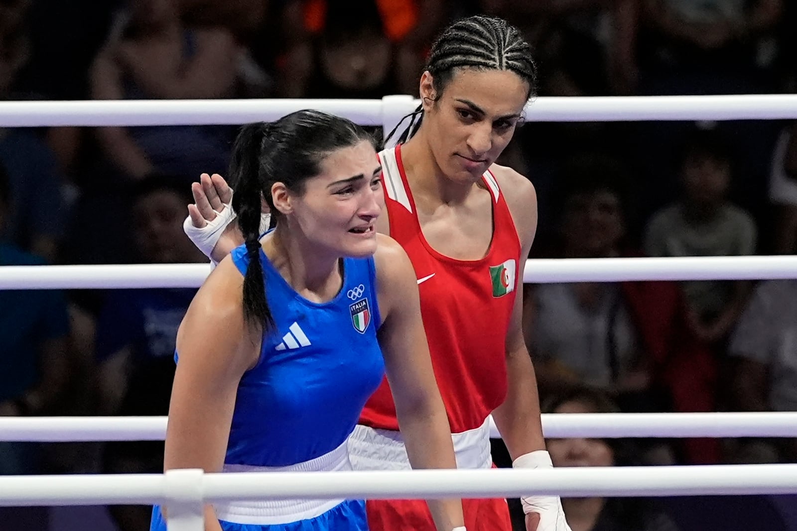 FILE - Algeria's Imane Khelif, right, looks at Italy's Angela Carini, following their women's 66kg preliminary boxing match at the 2024 Summer Olympics, Thursday, Aug. 1, 2024, in Paris, France. (AP Photo/John Locher, File)