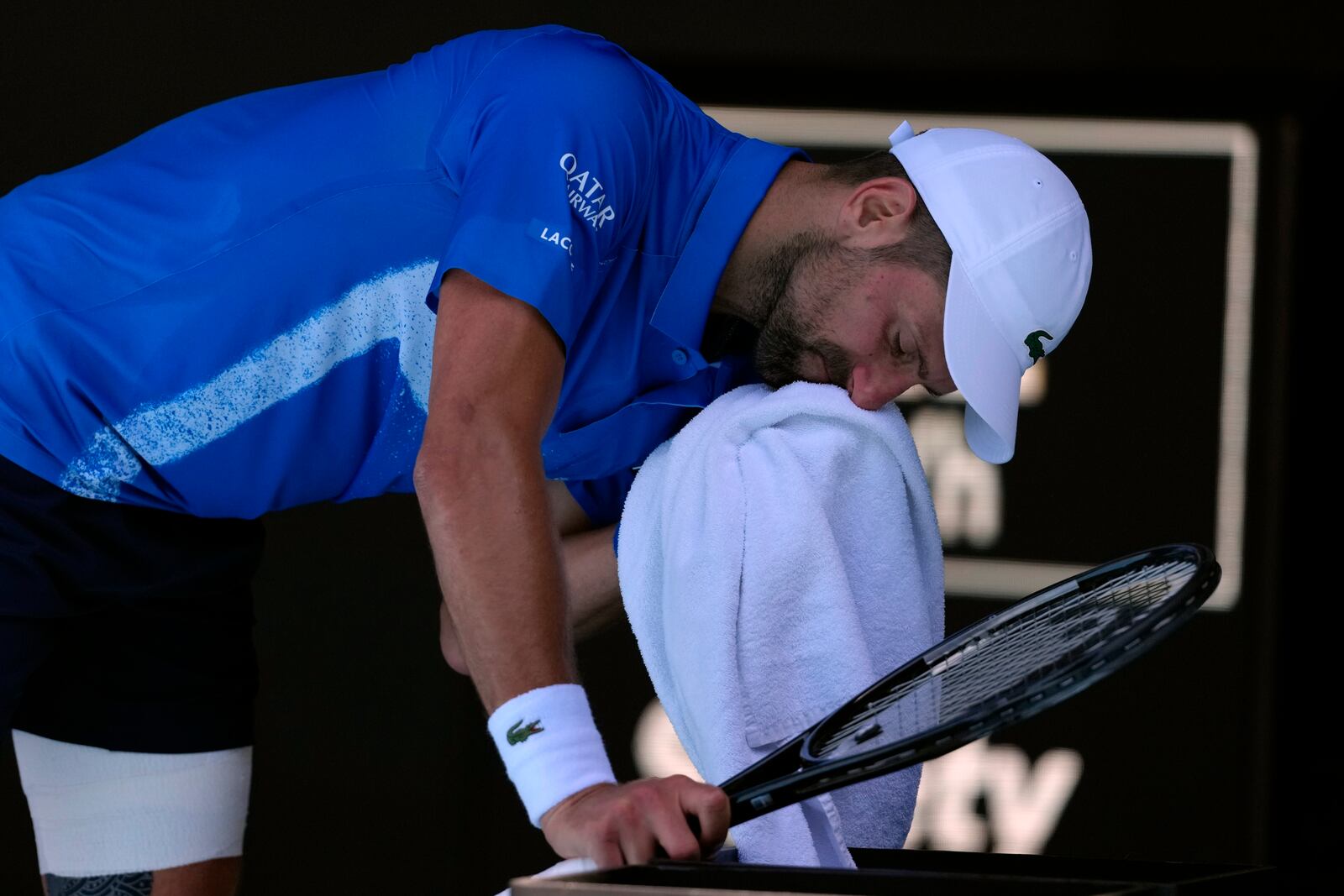 Novak Djokovic of Serbia reacts during his semifinal match against Alexander Zverev of Germany at the Australian Open tennis championship in Melbourne, Australia, Friday, Jan. 24, 2025. (AP Photo/Manish Swarup)