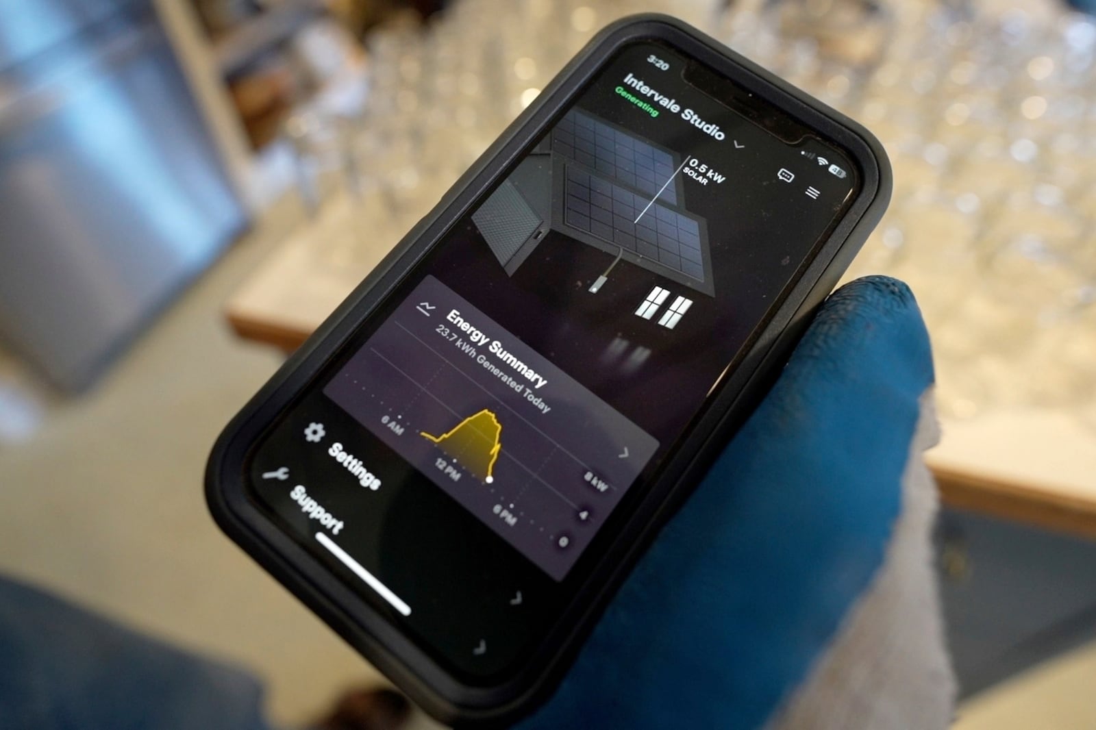 Farmer Hugh Lassen checks an app that shows the solar panel electricity production at Intervale Farm, Monday, Feb. 10, 2025, in Cherryfield, Maine. (AP Photo/Robert F. Bukaty)