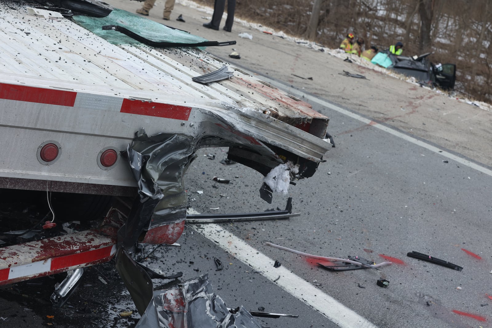 An SUV slammed into the back right corner of a broken down flatbed semi trailer Thursday morning, Feb. 10, 2022, on Interstate 70 West in Harmony Twp., killing its driver. BILL LACKEY/STAFF