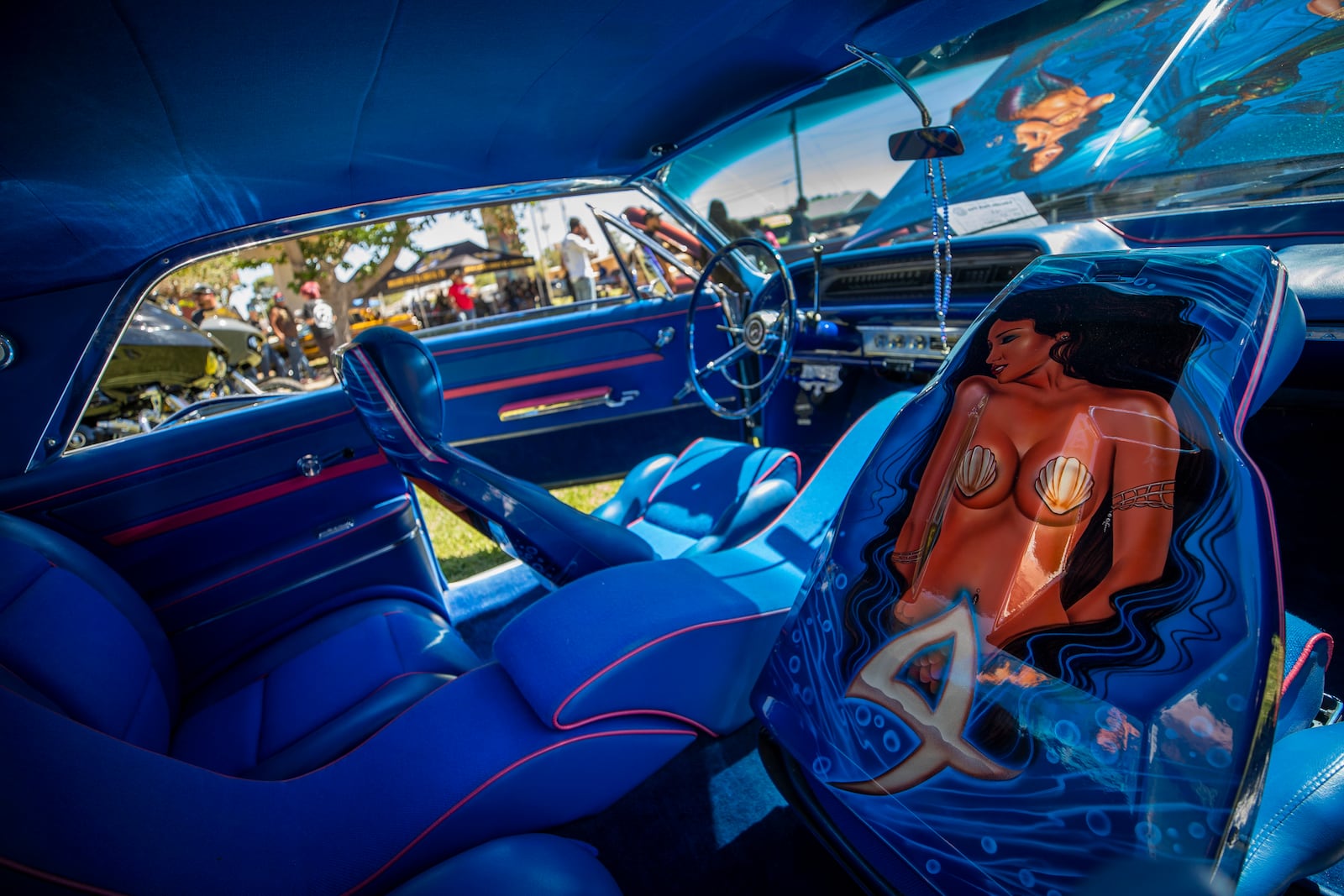 The decorated interior of a vintage car is pictured during a lowrider exhibition for the 20th anniversary of Lincoln Park in El Paso, Texas, Sunday, Sept. 22, 2024. (AP Photo/Andrés Leighton)