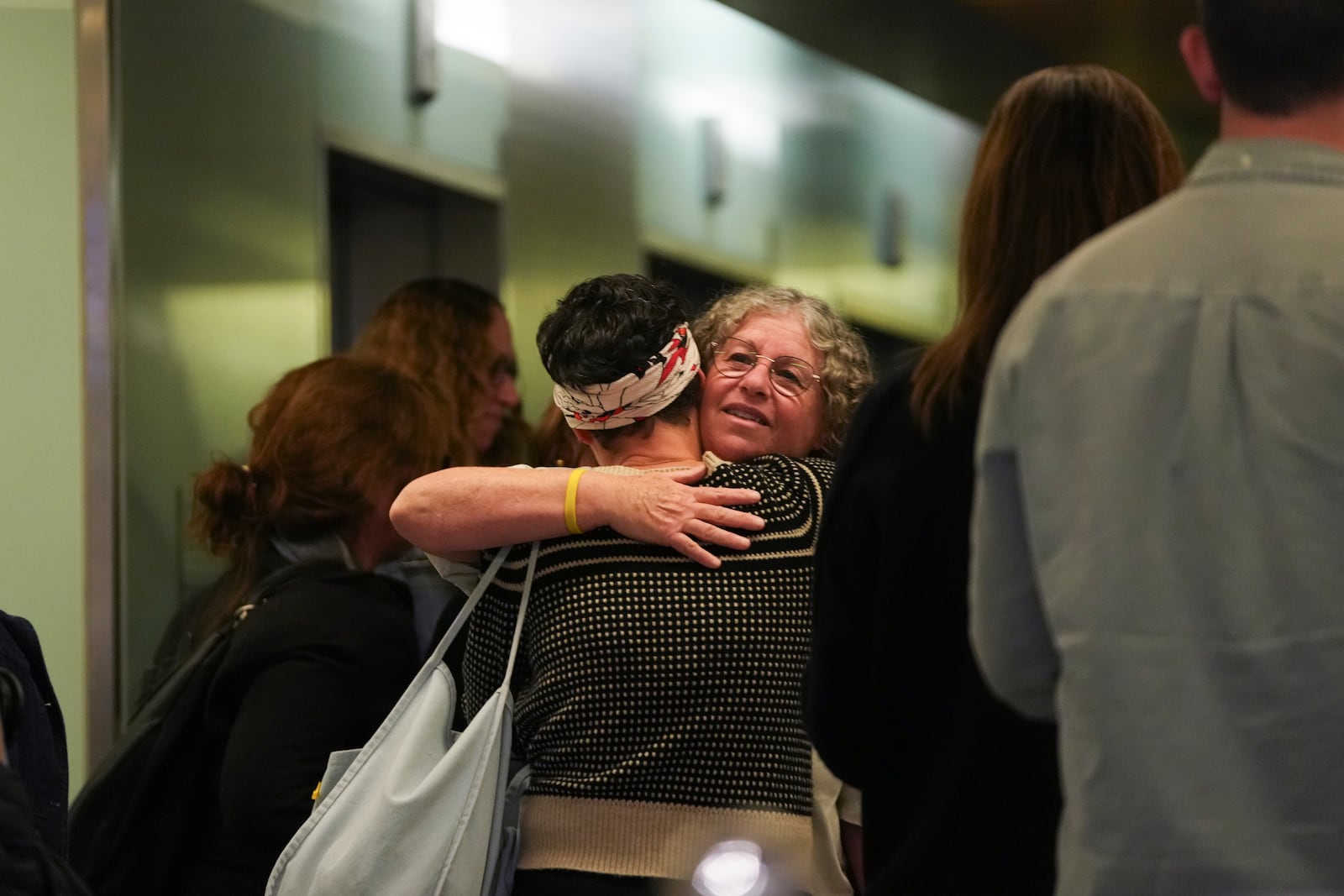 Freed hostage Aviva Siegel, wife of hostage Keith Siegel, who was freed on Saturday from Hamas captivity in Gaza, arrives to speak to journalists at Ichilov Hospital, where he is recovering, in Tel Aviv, Israel, Monday, Feb. 3, 2025. (AP Photo/Maya Alleruzzo)