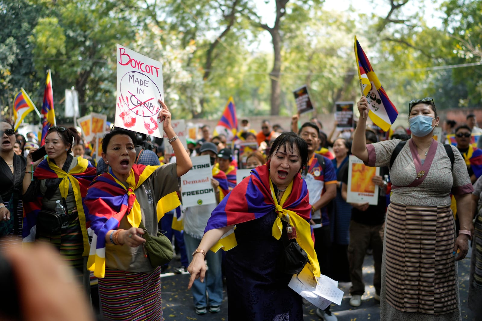 Exiled Tibetans shout slogans during a protest to commemorate the 1959 uprising in Tibet against the Chinese rule, in New Delhi, India, Monday, March, 10, 2025. (AP Photo/Manish Swarup)