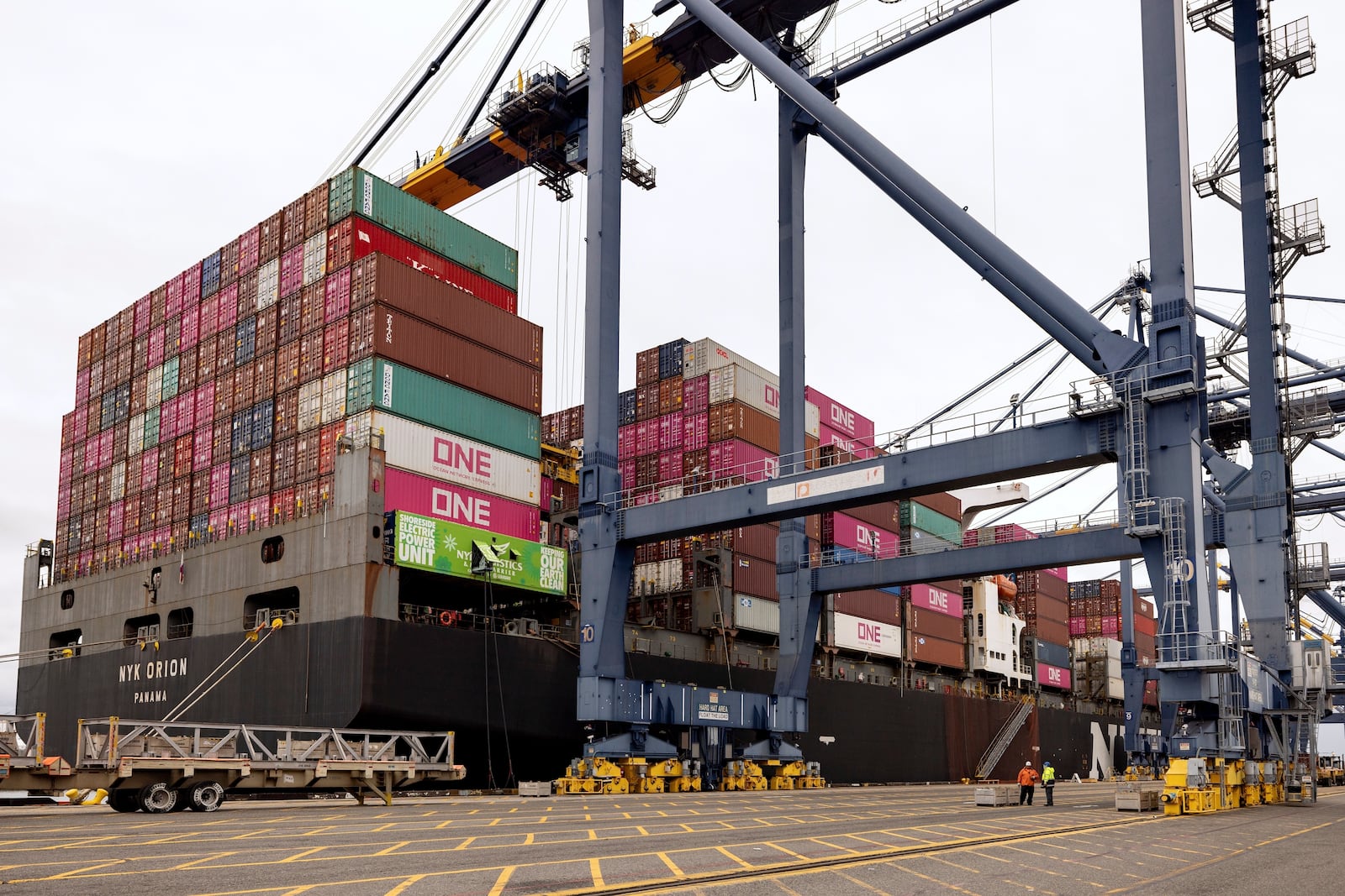 A cargo ship is plugged in to an electric grid rather than burning diesel at the Yusen Terminal in the Port of Los Angeles, Tuesday, March 11, 2025, in San Pedro, Calif. (AP Photo/Etienne Laurent)