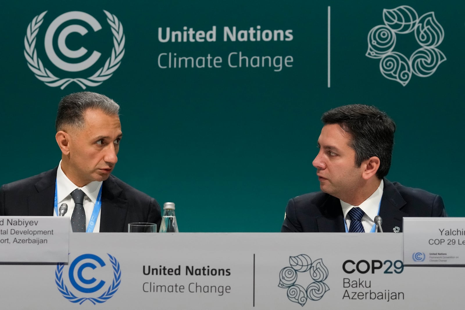 Rashad Nabiyev, Minster development and transport Azerbaijan, left, and Yalchin Rafiyev, Azerbaijan's COP29 lead negotiator, speaks during a news conference at the COP29 U.N. Climate Summit, Wednesday, Nov. 20, 2024, in Baku, Azerbaijan. (AP Photo/Rafiq Maqbool)