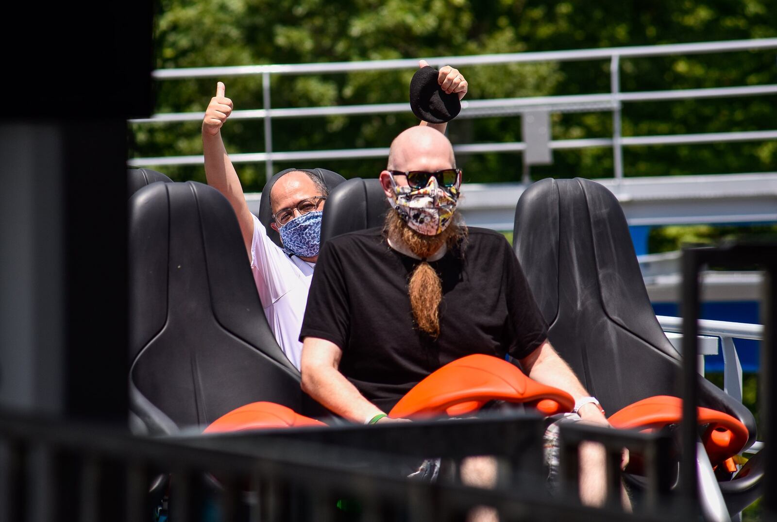 Coaster enthusiast Jared Ream, right, and Journal-News reporter Eric Schwartzberg ride the new Orion giga coaster on July 1 at Kings Island in Mason. NICK GRAHAM / STAFF