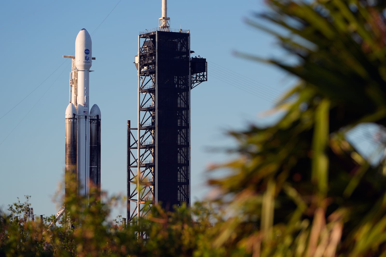 A SpaceX Falcon Heavy rocket with a NASA spacecraft bound for Jupiter stands ready for launch on pad 39A at the Kennedy Space Center Monday, Oct. 14, 2024 in Cape Canaveral, Fla. (AP Photo/John Raoux)