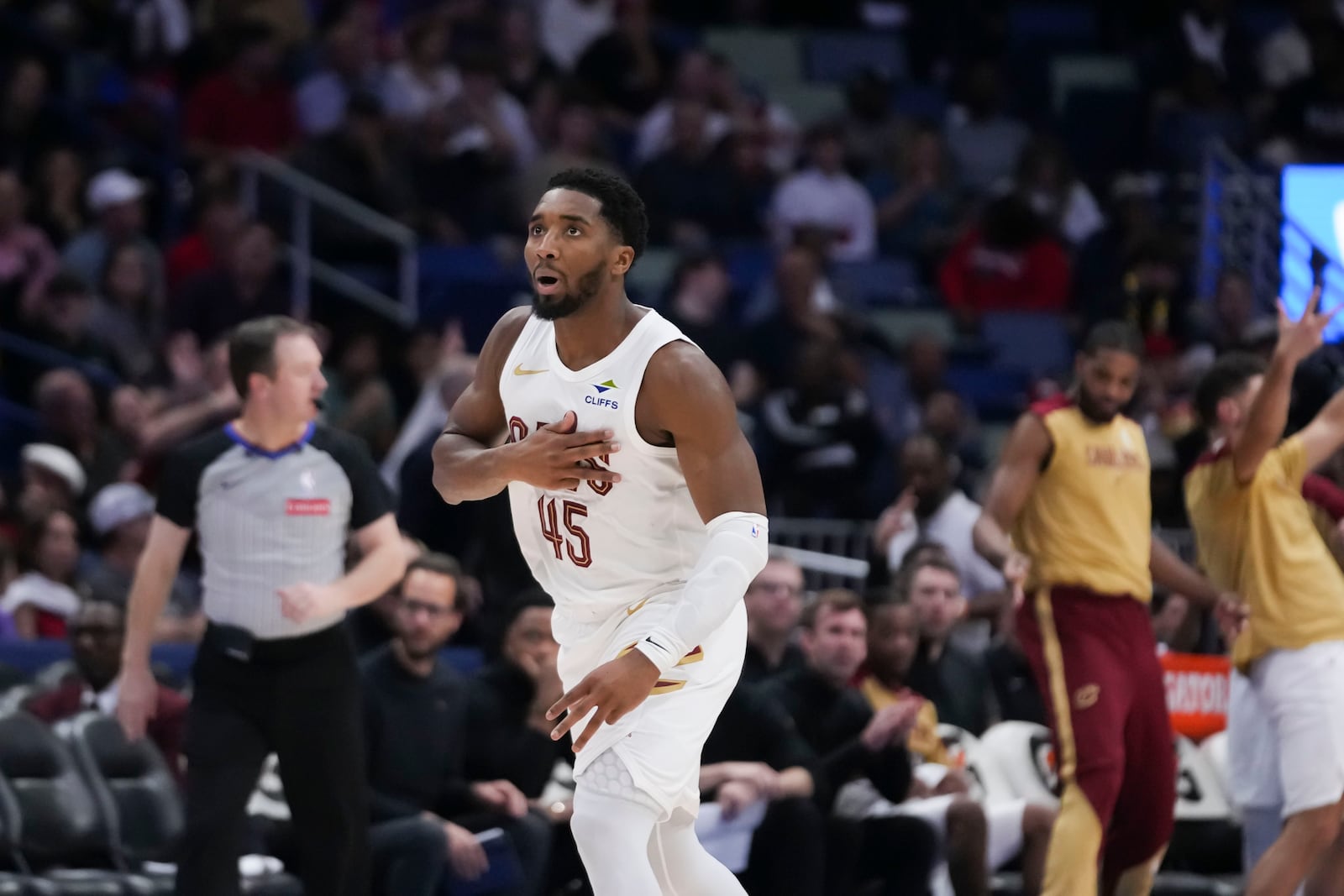 Cleveland Cavaliers guard Donovan Mitchell (45) reacts after making a 3-point basket in the second half of an NBA basketball game against the New Orleans Pelicans in New Orleans, Wednesday, Nov. 6, 2024. The Cavaliers won 131-122. (AP Photo/Gerald Herbert)