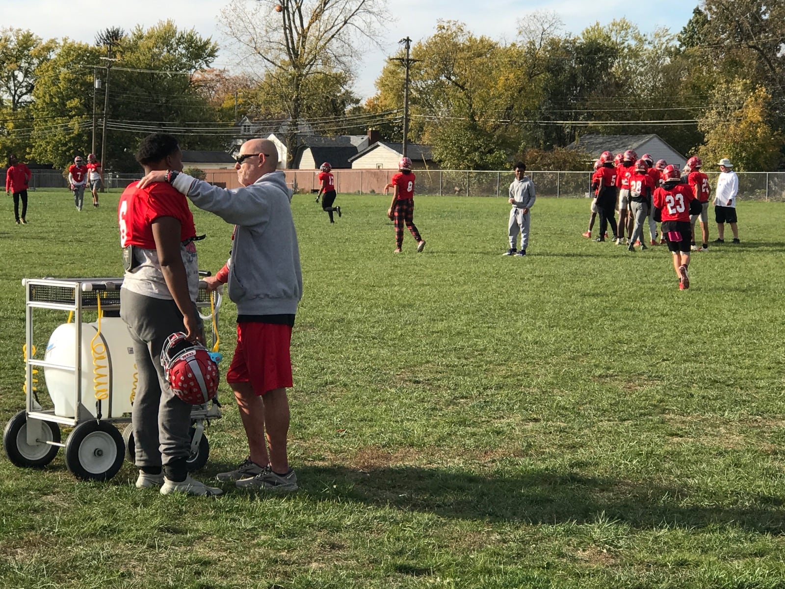 Northridge football coach Bob Smith counseling Eddye Conners at practice this season. Tom Archdeacon/CONTRIBUTED