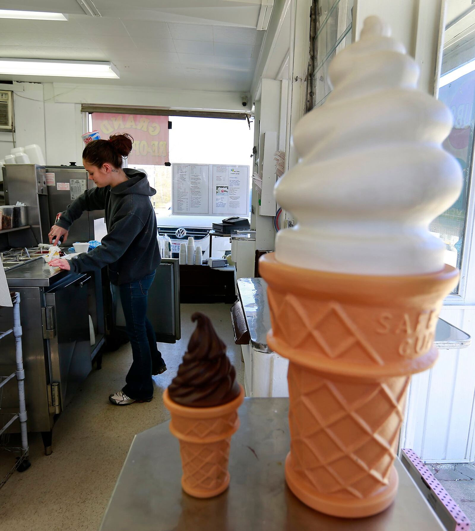 An employee makes a banana split for a customer at Lee Ann's Dairy Delight. Bill Lackey/Staff