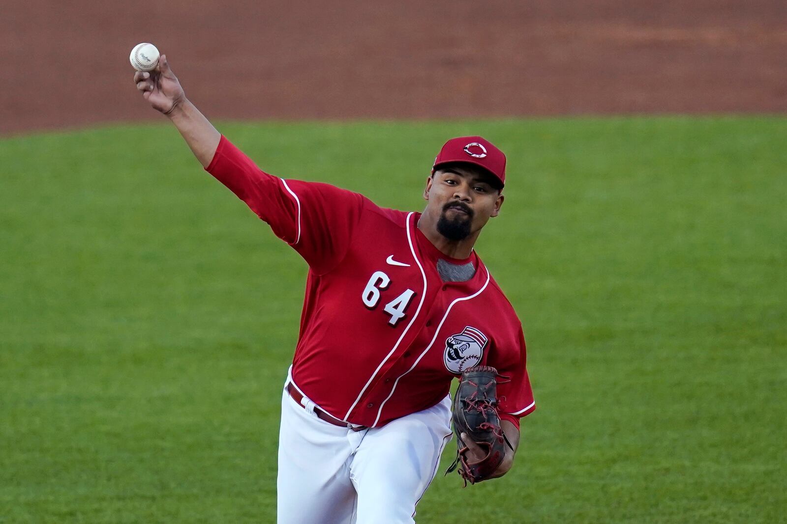 Cincinnati Reds starting pitcher Tony Santillan throws to a Texas Rangers batterduring the second inning of a spring training baseball game Wednesday, March 24, 2021, in Goodyear, Ariz. (AP Photo/Ross D. Franklin)